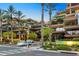 Luxury apartment building with palm trees and street view at 7121 E Rancho Vista Dr # 4004, Scottsdale, AZ 85251
