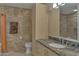 Bathroom with granite countertop, modern vanity, and tiled shower at 7121 E Rancho Vista Dr # 4004, Scottsdale, AZ 85251