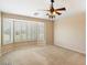 Large bedroom with bay window and ceiling fan at 1534 E Oak Rd, San Tan Valley, AZ 85140