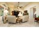 Relaxing living room with comfortable seating and large TV at 41906 W Solitare Dr, Maricopa, AZ 85138