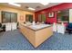Community sewing room with multiple sewing machines and work tables at 41906 W Solitare Dr, Maricopa, AZ 85138
