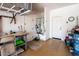 Garage with workbench, storage, and extra door at 41906 W Solitare Dr, Maricopa, AZ 85138