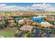 Expansive community overview with pool, lake, and parking at 41906 W Solitare Dr, Maricopa, AZ 85138