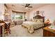 Large main bedroom with bay window and carpeted floors at 41906 W Solitare Dr, Maricopa, AZ 85138