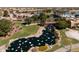 Arial view of community with lake, bridge and landscaping at 41906 W Solitare Dr, Maricopa, AZ 85138