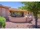 Covered patio with seating area and a beautiful view of the backyard at 41906 W Solitare Dr, Maricopa, AZ 85138
