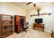 Home office featuring built-in shelving and a comfortable workspace at 41906 W Solitare Dr, Maricopa, AZ 85138