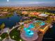 Aerial view of community pool, clubhouse, and landscaping at 41906 W Solitare Dr, Maricopa, AZ 85138