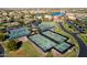 Aerial view of community with tennis and pickleball courts at 41906 W Solitare Dr, Maricopa, AZ 85138