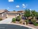 House exterior showcasing a landscaped yard and driveway at 41906 W Solitare Dr, Maricopa, AZ 85138