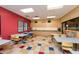 Community room with tables and chairs, perfect for gatherings at 41906 W Solitare Dr, Maricopa, AZ 85138