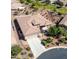 Single-story home with tile roof, driveway, and desert landscaping at 41906 W Solitare Dr, Maricopa, AZ 85138
