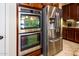 Kitchen boasts double oven and stainless steel refrigerator at 41906 W Solitare Dr, Maricopa, AZ 85138