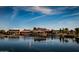 Resort-style community clubhouse with lake views and sailboats at 41906 W Solitare Dr, Maricopa, AZ 85138