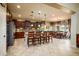 Open concept kitchen with island seating and breakfast area at 41906 W Solitare Dr, Maricopa, AZ 85138