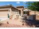 House exterior featuring a walkway, landscaping, and a two car garage at 41906 W Solitare Dr, Maricopa, AZ 85138