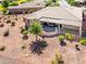 Backyard view of house with covered patio and landscaping at 41906 W Solitare Dr, Maricopa, AZ 85138