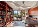 Home office with built-in bookshelves and backyard access at 6301 N 51St Pl, Paradise Valley, AZ 85253