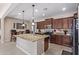 Well-equipped kitchen featuring an island and breakfast bar at 42915 W Kingfisher Dr, Maricopa, AZ 85138