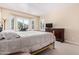 Spacious bedroom with a dresser and a window seat at 42915 W Kingfisher Dr, Maricopa, AZ 85138