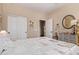 Spacious bedroom with double doors and large closet at 42915 W Kingfisher Dr, Maricopa, AZ 85138