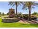 Attractive community entrance with landscaping at 42915 W Kingfisher Dr, Maricopa, AZ 85138