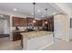 Modern kitchen with granite countertops and stainless steel appliances at 42915 W Kingfisher Dr, Maricopa, AZ 85138