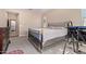 Comfortable bedroom with a king-size bed and ample floor space at 42915 W Kingfisher Dr, Maricopa, AZ 85138