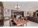 Bright dining room with a view of the kitchen and living room at 42915 W Kingfisher Dr, Maricopa, AZ 85138