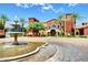 Community entrance with fountain and Mediterranean style building at 42915 W Kingfisher Dr, Maricopa, AZ 85138