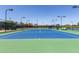 Well-maintained tennis court with ample lighting at 42915 W Kingfisher Dr, Maricopa, AZ 85138