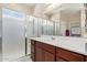 Clean bathroom with a shower and modern vanity at 42915 W Kingfisher Dr, Maricopa, AZ 85138