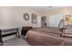 Bright bedroom with a king-size bed and built-in desk at 42915 W Kingfisher Dr, Maricopa, AZ 85138