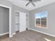 Spacious bedroom with a large closet and window offering a view at 2935 W Joy Ranch Rd, Phoenix, AZ 85086