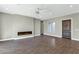 Living room with fireplace and wood-look tile floors at 2935 W Joy Ranch Rd, Phoenix, AZ 85086