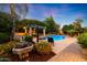 Inviting pool area with pergola, fountain, and lush landscaping at 4530 E Yucca St, Phoenix, AZ 85028