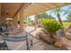 Spacious covered patio with comfortable seating and pergola at 9121 E Crystal Dr, Sun Lakes, AZ 85248