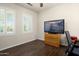 Home office with dark tile floors and large window at 21633 N Black Bear Lodge Dr, Surprise, AZ 85387