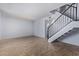 Living room with tile floors and staircase to upper level at 6320 N 47Th Ave, Glendale, AZ 85301