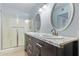 Bathroom featuring double sinks, granite countertop and shower at 6320 N 47Th Ave, Glendale, AZ 85301