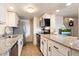 Modern kitchen with granite countertops, stainless steel appliances, and white cabinets at 1213 E Lawrence Ln, Phoenix, AZ 85020