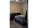 Spacious bedroom featuring a dresser and a queen-size bed at 30893 W Pinchot W Ct, Buckeye, AZ 85396