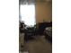 Bright bedroom with large window, dresser, and comfortable bed at 30893 W Pinchot W Ct, Buckeye, AZ 85396