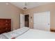 Bedroom with a double bed, ceiling fan, and double door closet at 42424 N Gavilan Peak Pkwy # 50104, Anthem, AZ 85086