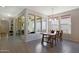 Bright dining area with wooden table and chairs, and view of backyard at 2342 N Delaney Dr, Buckeye, AZ 85396