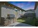 Outdoor kitchen and putting green for backyard entertainment at 2342 N Delaney Dr, Buckeye, AZ 85396