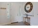 Bright entryway with wood-look floors, white door, and decorative wall clock at 2342 N Delaney Dr, Buckeye, AZ 85396