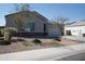 House exterior with a two-car garage and nicely landscaped yard at 30893 W Pinchot W Ct, Buckeye, AZ 85396