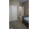 Bedroom with double doors to closet and a bed at 30893 W Pinchot W Ct, Buckeye, AZ 85396