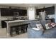Open-concept kitchen with island seating and stainless steel appliances at 30893 W Pinchot W Ct, Buckeye, AZ 85396